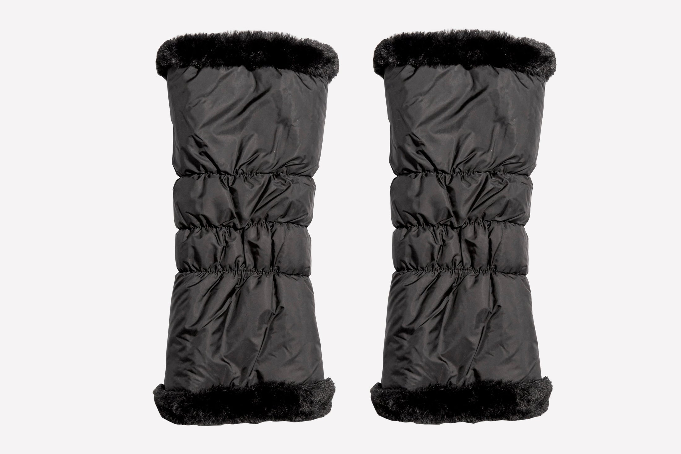 Pair of black winter leg warmers with black fur trim on a white background
