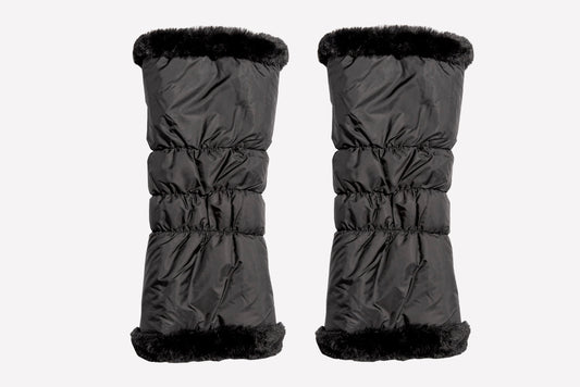 Pair of black winter leg warmers with black fur trim on a white background