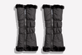 Load image into Gallery viewer, Pair of black puffer leg warmers with zipper pulls with fur trim on a white background