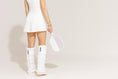 Load image into Gallery viewer, warmth flip fit white reversible zip up puffer fabric & faux fur leg warmers
